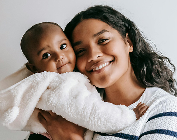 baby and mom hugging