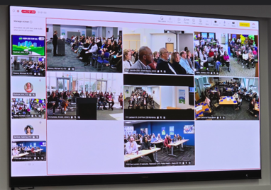 Presentation slide showing multiple photos of town hall meetings and group discussions.